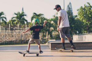 Father and son skateboarding - Wealth Connexion