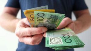 Money bills on hand - Wealth Connexion