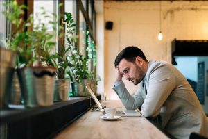 Man Contemplating on Borrowing to Invest - Wealth Connexion