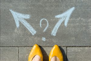 Woman Considering Her Options - Sacrificing Your Mortgage to Build Wealth - Wealth Connexion