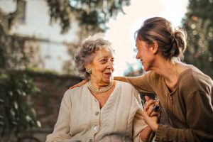 Woman giving hug to an elderly woman - Aged Care Financial Advice Image