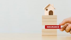 Jenga Block With a House on Top and Insurance Block - Loan Protection - Wealth Connexion Blog Image