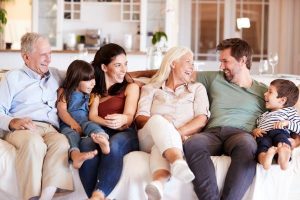 Family on couch having a happy conversation - Wealth Connexion Blogpost image