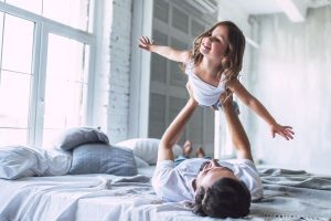 Father Playing With Her Daughter in Bedroom – Trauma Insurance – Wealth Connexion Blog Image
