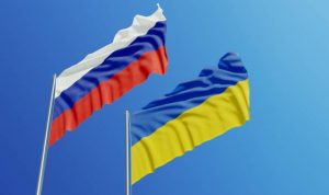 Russian and Ukrainian flags waving - Wealth Connexion