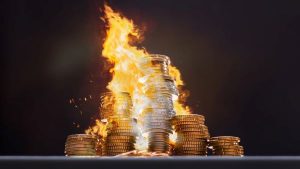 A pile of coins on fire - Wealth Connexion