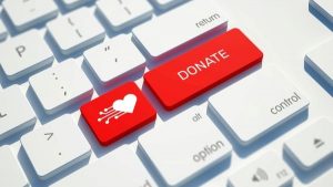 Keyboard buttons with donate and heart icons - Wealth Connexion