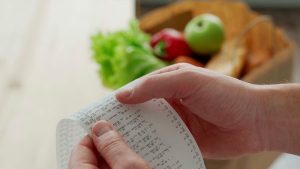 Hands holding at a receipt - Wealth Connexion