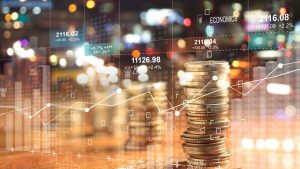 A graphic hologram showing econmics with stacked coins - Wealth Connexion blog image