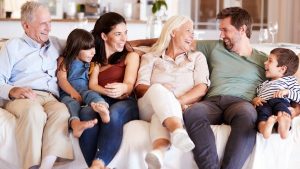 A family sitting on the couch - Wealth Connexion blog image