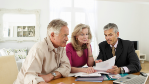 Couple talking to a financial advisor - Wealth Connexion blog image