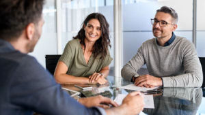 A couple talking to a financial adviser - Wealth Connexion blog image