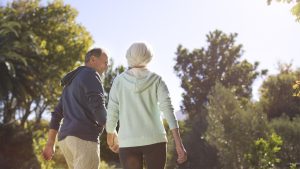 Two elderly couple walking outdoors - Wealth Connexion blog image