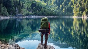 hiker staring into lake | Wealth Connexion Blog Image