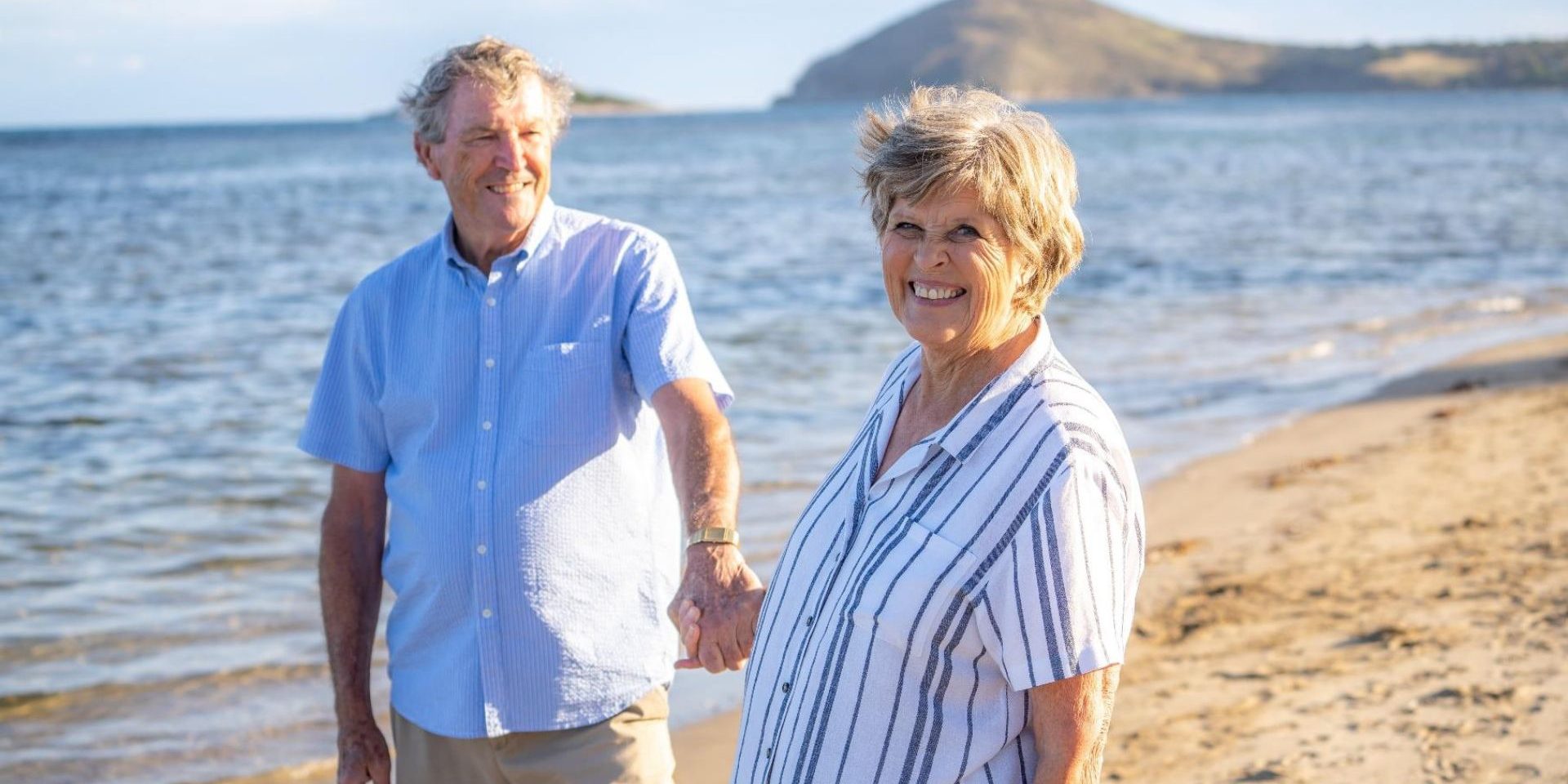 35 senior couple holding hands at the beach | Wealth Connexion Blog Image