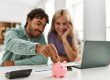 Young couple controlling family finances at home
