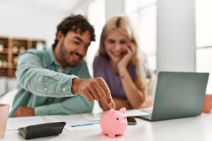 Young couple controlling family finances at home