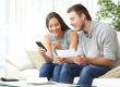 Couple reading mail at home